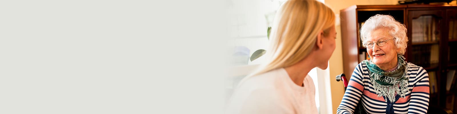 An elderly woman with a young woman