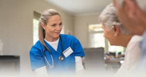 A nurse talking with residents